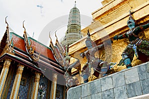 The giant statue ,The giant statue supporting golden pagoda on Grand Palace in Phra Kaew Temple, Bangkok Thailand.