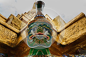 The giant statue ,The giant statue supporting golden pagoda on Grand Palace in Phra Kaew Temple, Bangkok Thailand.