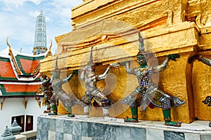 The giant statue ,The giant statue supporting golden pagoda on Grand Palace in Phra Kaew Temple, Bangkok Thailand.