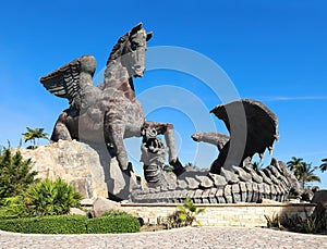 Giant statue of Pegasus defeating a dragon.
