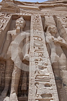 Giant statues of Ramses II and Nefertari at Abu Simbel temple