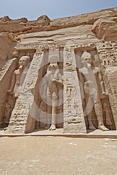 Giant statues of Ramses II and Nefertari at Abu Simbel temple