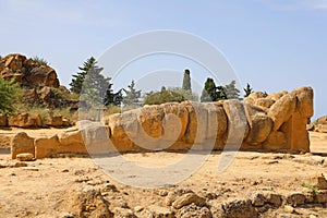 Giant Telamon, Atlas supporting statue of ruined Temple of Zeus in the Valley of Temples of Agrigento, Sicily, Italy. UNESCO World