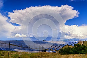 Giant thunderstorm cloud above solar power plant in Provance, Fr