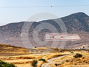 Giant Turkish Republic of Northern Cyprus and nationalist slogan painted on the flank of the Kyrenia aka Girne mountains photo