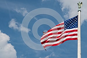 Giant Usa American flag stars and stripes on sky background