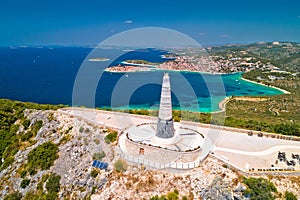 Giant Virgin Mary statue on hill above Primosten aerial view