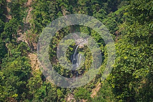 Giant waterfall amoung the forest from top view (Rinjani, Lombok, Indonesia)