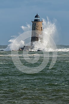 Giant Waves Surround Stone Lighthouse in Maine