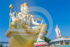 Giant white Brahma statue with blue sky background. Brahma is the Hindu Creator god. He is also known as the Grandfather and supre