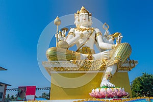 Giant white Brahma statue with blue sky background. Brahma is the Hindu Creator god. He is also known as the Grandfather and supre
