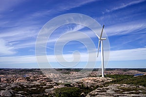 Giant wind turbine in a flat cliffy landscape