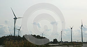 giant wind turbines to produce electricity with the force of win