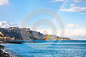 Giardini Naxos resort and rainbow in Ionian Sea