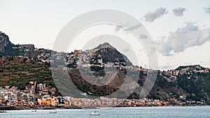 Giardini Naxos town below and Taormina city above