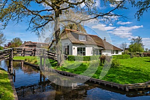 Giethoorn Netherlands, at canal and traditional house in village