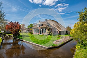 Giethoorn Netherlands, canal and traditional house in village