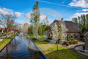 Giethoorn Netherlands at canal and traditional house in village