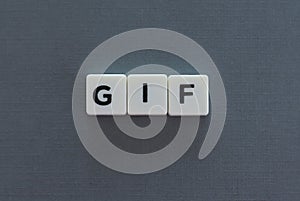 GIF word made of square letter word on grey background photo