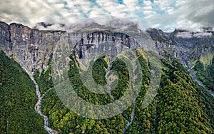 Giffre valley of mountain range with cascade and foggy in French Alps at Sixt Fer a Cheval, France