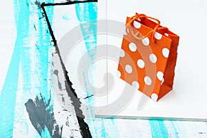 Gift bag is on colored background