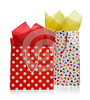 Gift bags with paper on white background