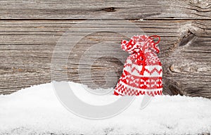 Gift Bags with winter snow on wooden boards