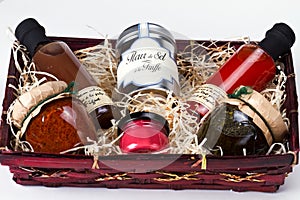 Gift basket with gourmet condiments and sauces. photo