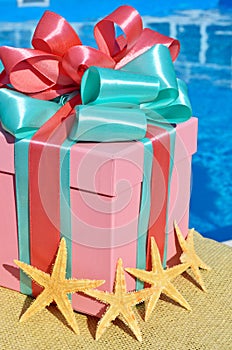 Gift box against with starfish.