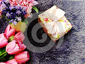Gift box with artificial tulip flowers bouquet