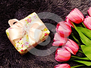 Gift box with artificial tulip flowers bouquet