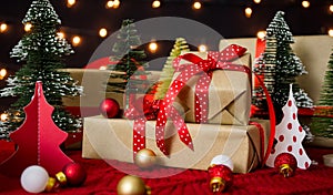 Gift box, balls and christmas tree with bokeh lights for christmas holiday concept