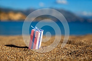 Gift box on a beach