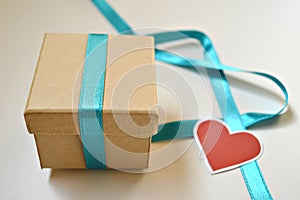 Gift box with blue ribbon