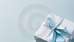 Gift box with blue satin bow with space for text.