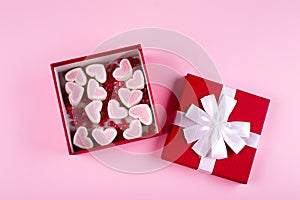 Gift box with candy sweet heart for Valentines day. Flat lay, top view