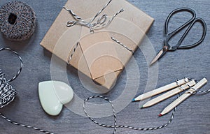 Gift box with ceramic heart, pencils and old scissors