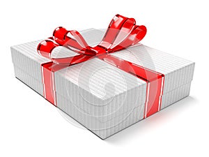 Gift box decorated with shiny red ribbon