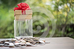 Gift box on dollars in the glass