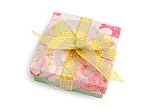 Gift box with festive floral prints, golden ribbon bow