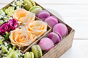 Gift box with flowers and macaroon