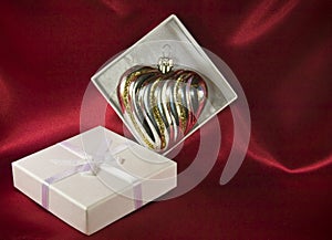 Gift box with a glass Christmas decoration