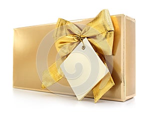 Gift box with gold bow and blank label