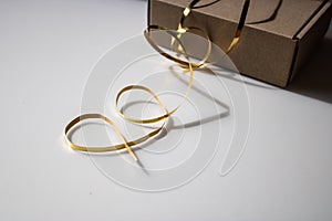 Gift box with golden ribbon close-up - Image