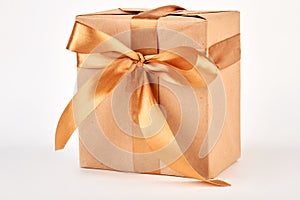 Gift box with golden ribbon.