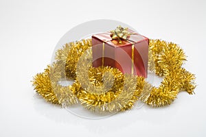 Gift box and golden tinsel
