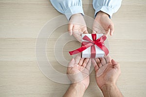 Gift box hand holding a gift box Glad to be the giver of surprise with excitement, the joy on the holidays, Christmas, birthdays,