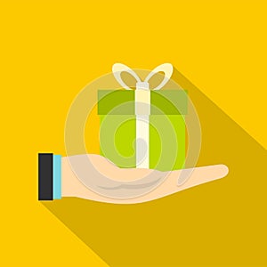 Gift box in hand icon, flat style