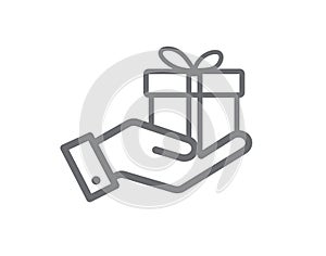 Gift box in hand isolated on white background. Hand hold gift. Design for website and mobile apps. Line icon. Vector illustration