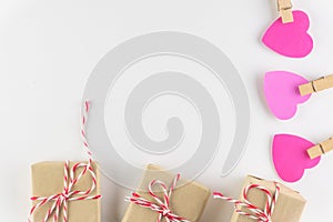 Gift box and Hand-made pink love hearts isolated on white wooden background, Happy valentine`s day. holiday background